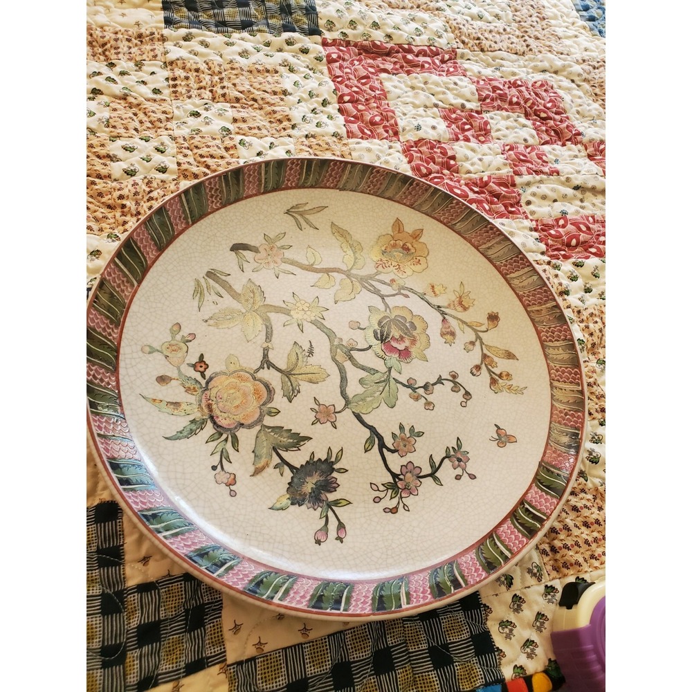 Plate 12" hand painted stamped in orange made in china and # 17 unknown about it